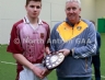 North Antrim Youth Development Officer Paddy Gray presenting Ruairi Og Cushendall Team Captain Mark Emerson with the TeamKit U14 Division 1 Airborne Hurling League Shield